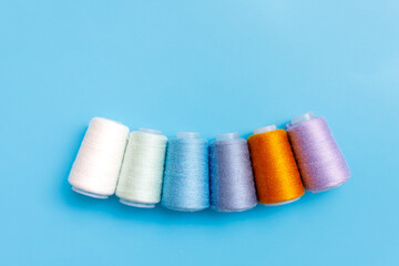 Skeins of wool yarn and knitting needles.