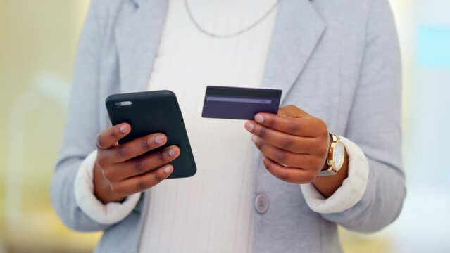 Woman making an online payment on her phone with a credit. Closeup of a person doing online shopping or applying for a loan via banking app. Female paying off insurance debt and debit orders