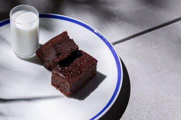 Pieces of chocolate pie with a glass of pullets