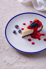 Napoleon with powdered sugar, blueberries, strawberries, blackberries and jam