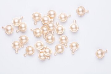 Hyaluronic acid capsules isolated on white background.