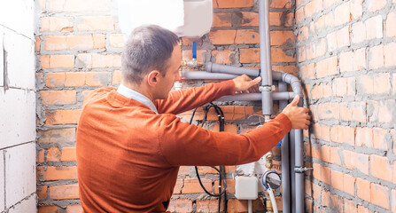 a plumber engineer repairing pipes at work