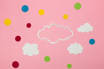 cloud as copy space, small clouds and colorful dot around the cloud, pink background, creative art modern design, abstract idea, clear air, pink sky

