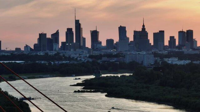 Aerial, elevation view of Siekierkowski Bridge in Warsaw a capital city during sundown.