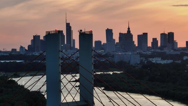 Aerial, elevation view of Siekierkowski Bridge in Warsaw a capital city during sundown.