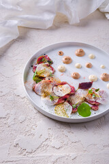 Salad with lightly fried meat, radish slices, mung bean salad, leaves and two types of sauce