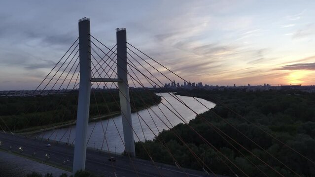 Aerial, elevation view of Siekierkowski Bridge in Warsaw a capital city during sundown.