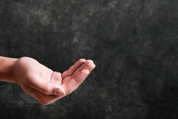 Empty hand of a poor hungry man outstretched for alms. Problems with the supply of wheat and flour,...