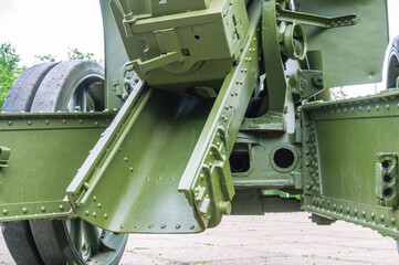 The bolt of a large-caliber artillery piece. A weapon that shoots at a large trajectory. Cannon-howitzer for long-range shooting. Shield cover of the howitzer.