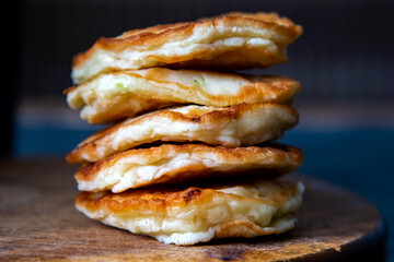 Zucchini fritters, vegetarian zucchini pancakes, served with sour cream