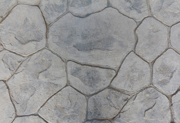 Obraz premium Grey pavers floor background. Floor decorative tiles with large stones texture.