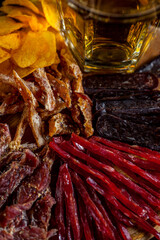 Dried chicken with sesame seeds, caviar, dried horse meat, pork jerky, chips