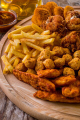 French fries, cheese balls, deep-fried chicken legs, chicken nuggets, wing