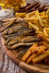 French fries, fish fried in batter, rye croutons, white bread croutons