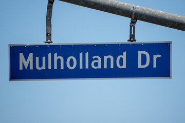 Mulholland Drive Street Sign Against a Clear Blue Sky
