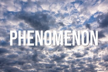 PHENOMENON - word on the background of the sky with clouds.