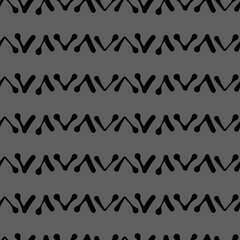 Vector.  Abstract monochrome ethnic seamless pattern. Artistic background hand drawn simple shapes of angle brackets, checkmarks. Mosaic abstract background. Repeating geometric texture. Dividers.