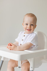cheerful little boy in high chair, health, space for text, banner, card