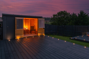 New Laid Composite Decking Ash Colour and with Decking Lights Installed. Lights are Illuminated