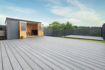 New Laid Composite Decking Ash Colour and with Decking Lights Installed. - obrazy, fototapety, plakaty
