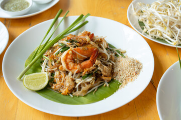 Close-up of Pad Thai Seafood, a dish made from noodles, is a famous dish of Thailand recommended for tourists visiting the country. It consists of rice noodles and shrimp and squid.