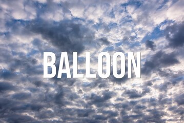 BALLOON - word on the background of the sky with clouds.