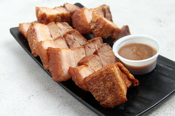 Freshly cooked Filipino food called Lechon Kawali or crispy deep fried pork belly