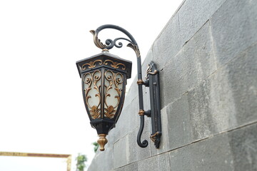 bronze pinggie street lamp with traditional ornament.