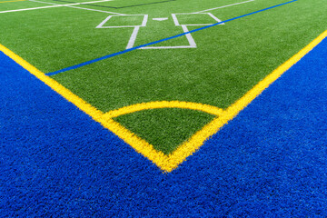 Synthetic turf multi sport field with soccer, football, lacrosse and baseball batters box lines in...