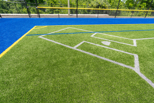 Synthetic turf multi sport field with soccer, football, lacrosse and softball batters box lines in white, gray, yellow and red. 