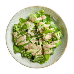 Green vegetable salad with broccoli and greenery with sauce isolated on white background top view