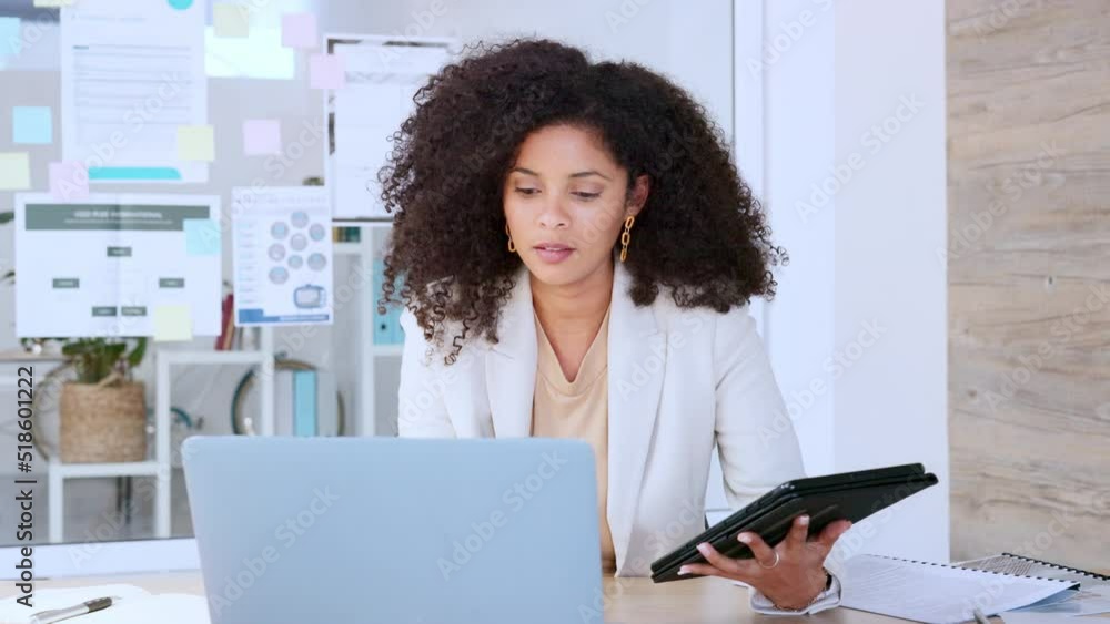 Aufkleber Software analyst typing on laptop and comparing with a tablet while analysing business or company information data. Corporate woman doing research, testing an app and communicating with developers