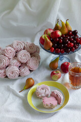 Homemade Zephyr on table with fruits and tea