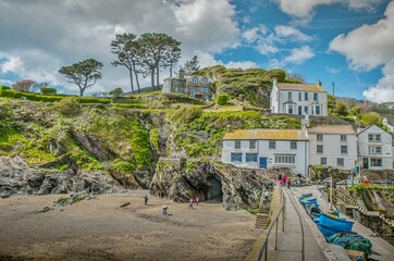 Shot of houses on the hill with cloudy skies near Polperro beach