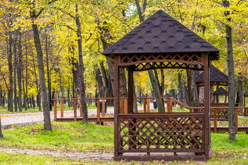 Wooden gazebos in park on an autumn day no people