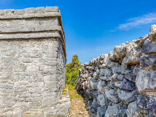Ancient Tulum ruins Mayan site temple pyramids artifacts seascape Mexico.
