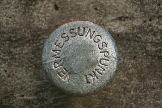 A survey point on a pedestrian bridge in Bad Homburg, Germany.