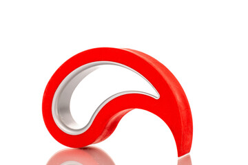 One red door stopper, close-up, isolated on white background.