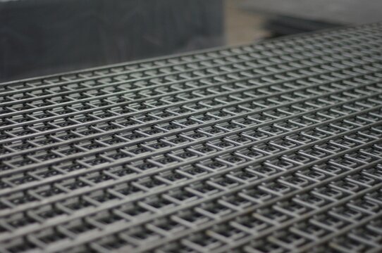 Stack of profile style welded mesh fencing panels, uncoated, manufactured in the factory