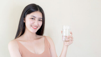 Beautiful beauty woman Asian cute girl feel happy drinking Clean drink water for good health in the...