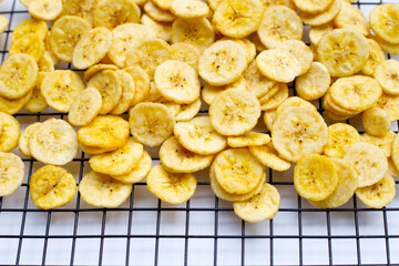 Banana slice chips on white background.