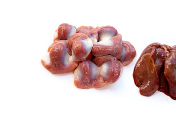 Mixed chicken entrails in white plate on yellow background.