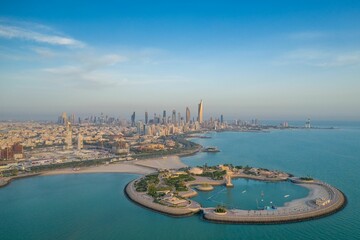 High-angle shot of The Green Island with a skyline of the city of Kuwait in the background