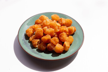Dried longan on white background.