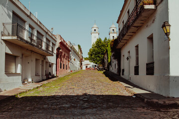 Street view of Colonia del Sacramento and Santisimo Sacramento church in uruguay - obrazy, fototapety, plakaty