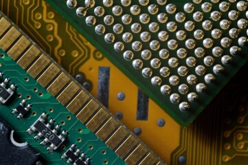 microprocessor on the background of the microcircuit of the motherboard