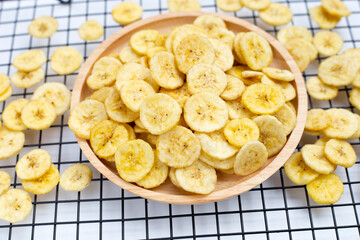 Banana slice chips on white background.