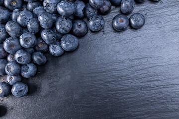 Fresh blueberries summer fruits for a healthy diet on stone background