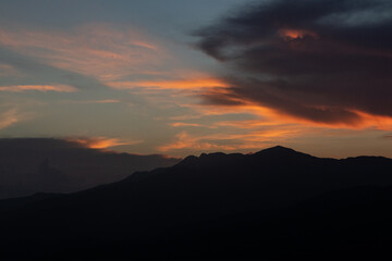 sunset over mountains with orange and red colors