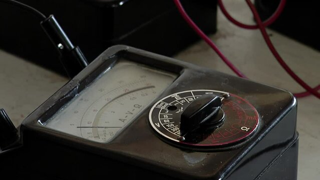 An Old Analog Multimeter at the Workshop of a Prison. Close Up.
